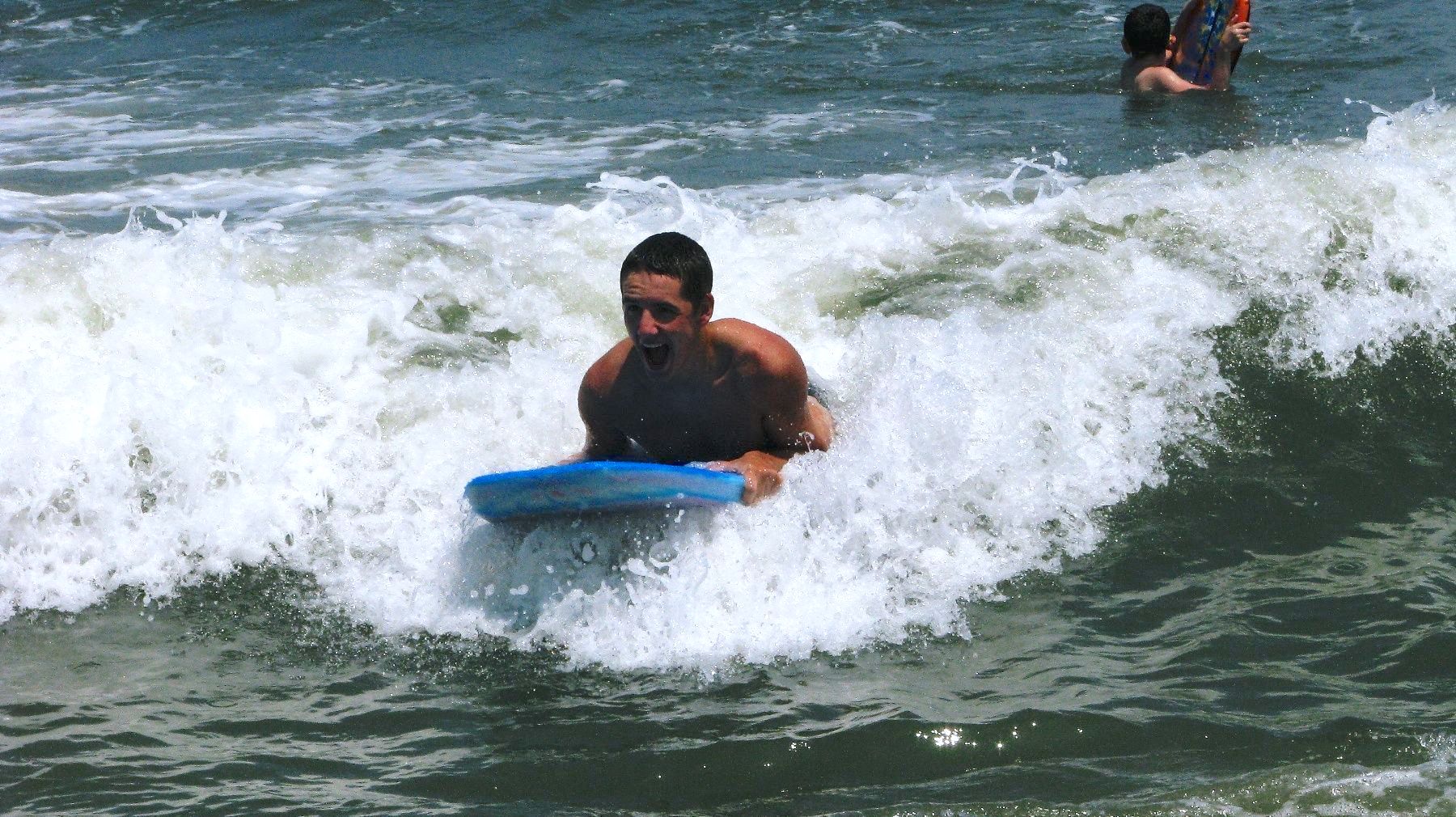boy boady boarding on wave