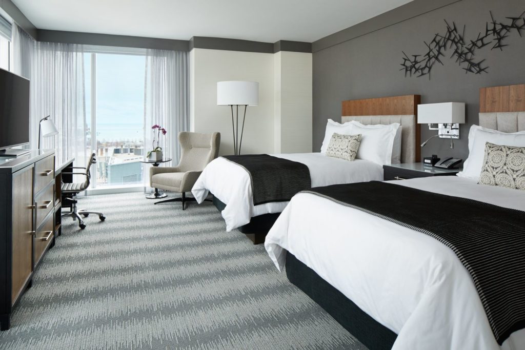 The Loews Chicago has large corner guestrooms with two queen beds, ideal for families with younger children. Photo c. Loews Hotels