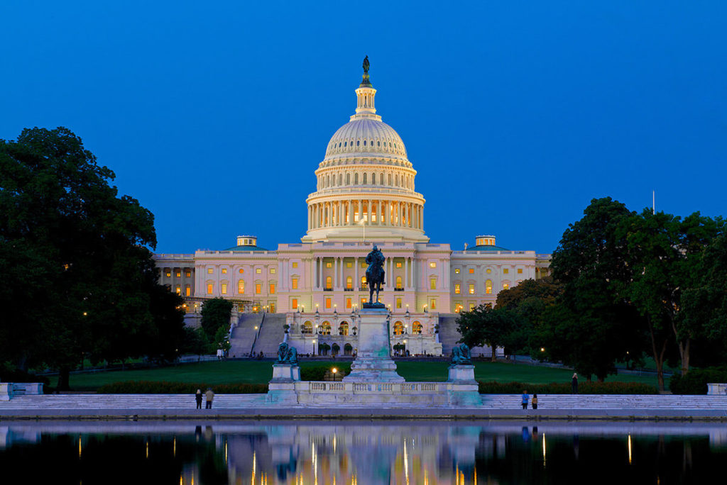 Capitol building in Washington DC illuminated at  night.