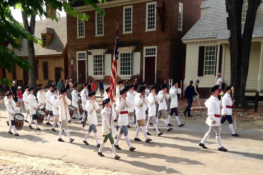 Reenactors march in Colonial Williamsburg to highlight Virginia's history.