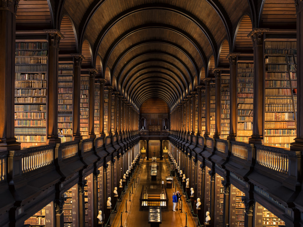 Couple visiting the Long Room at Trinity College, Dublin