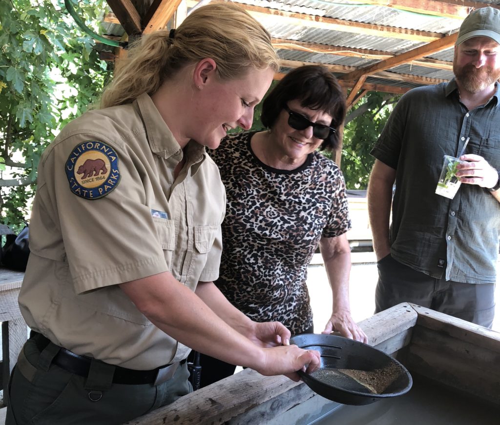 Park ranger demonstrates gold panning to guests at Marshall Gold Discovery State Park in Coloma.