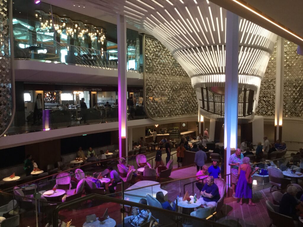 On Celebrity Edge, a three-story atrium surrounded by dining and nightlife
