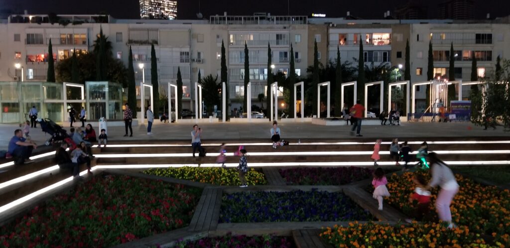 Public garden playspace at night in downtown Tel Aviv at Habima Square.