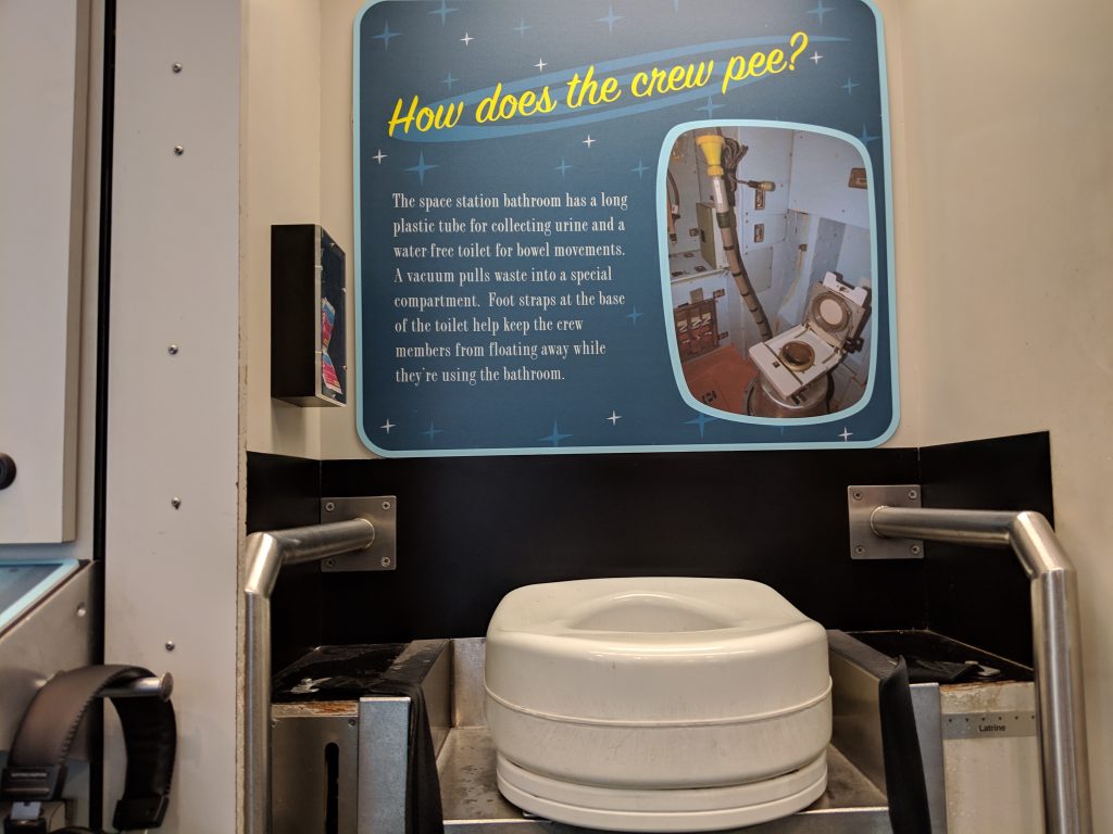 The space exhibit at COSI with a toilet seat