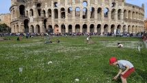 Children on lawn of Colosseum.