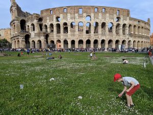 Children on lawn of Colosseum.