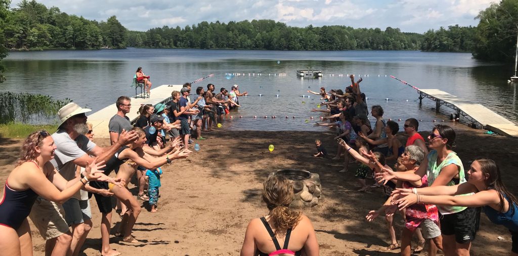 Families compete in Water balloon toss at Camp Nawakwa.