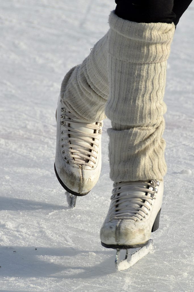 closeup ice skates on ice