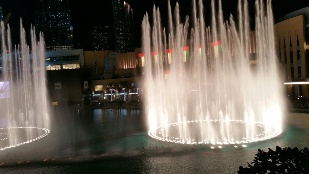 The dancing lights of the Dubai Fountains change color and move in time to music.