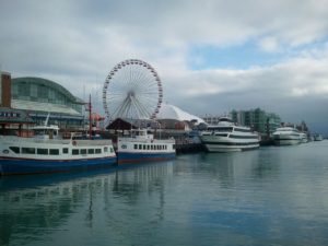 Sightseeing boats and attractions line Chicago's Navy Pier.