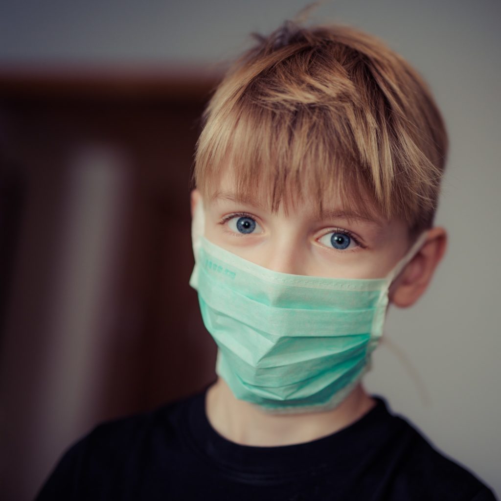 boy in surgical mask