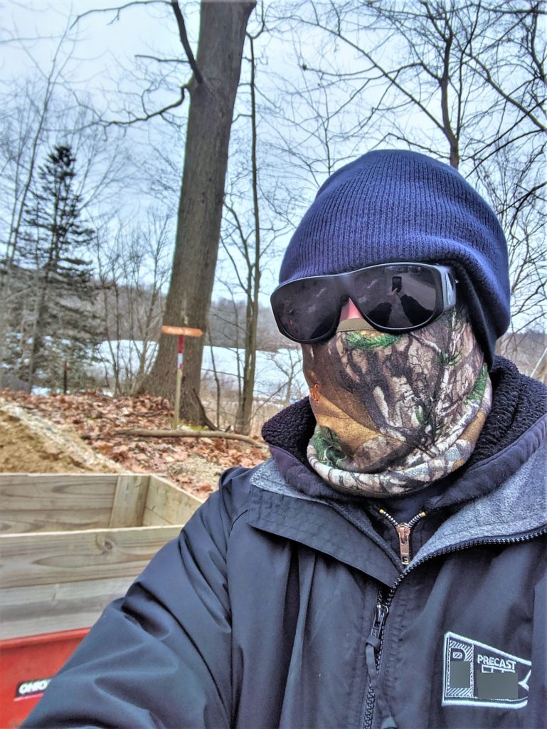 face covering on man in woods