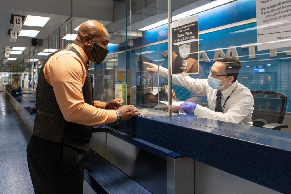 Amtrak ticket buyer in facemask.