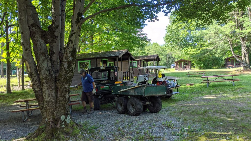 Grounds crew at a camping cabin