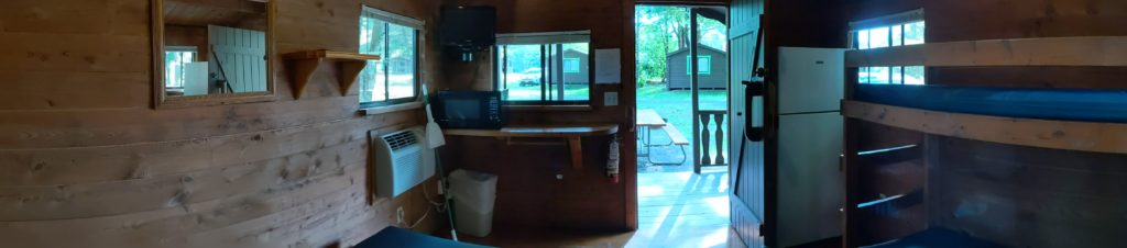 Panoramic view inside our Jellystone Park Rustic Cabin.