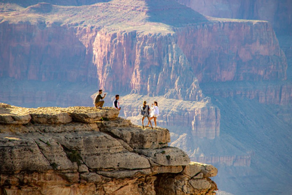 Kdis taking selfies on rim of Grand Canyon