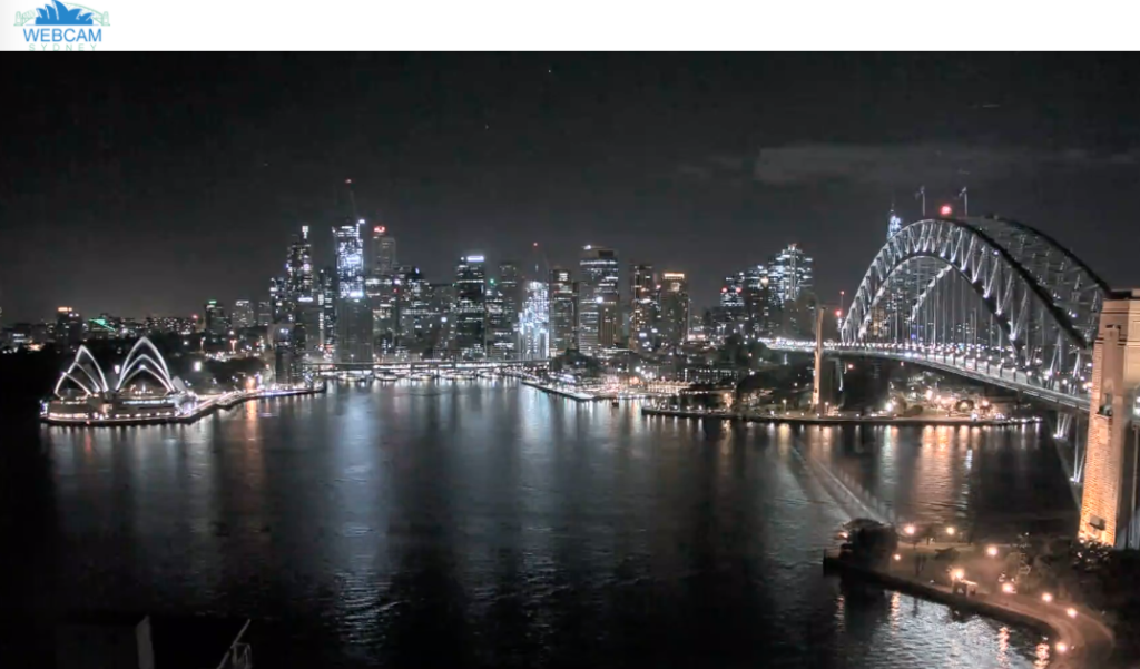 The Sydney Harbor Bridge seen at night on a webcam.