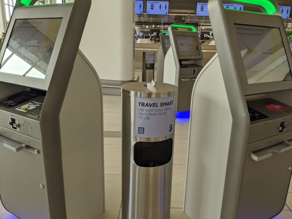 Hand wipes stations are next to every check-in kiosk at LaGuardia Terminal B