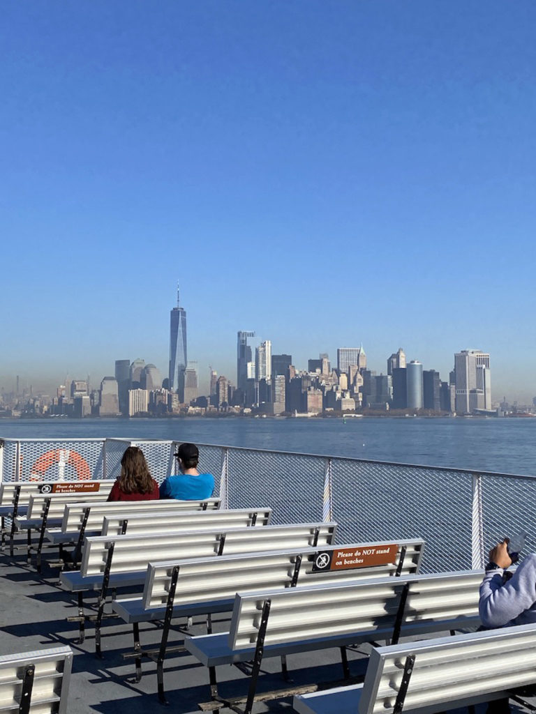 Statue Cruises ferry sailing back to Manhattan from State of Liberty.