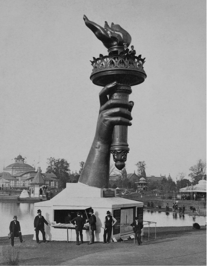 French craftsmen arrange the 350 parts of the Liberty statue shipped from France for assembly on Liberty Island.