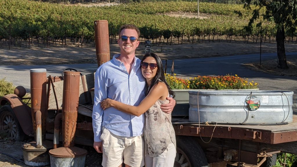 Couple in front of flower display at Gundlach Bundschu Winery.