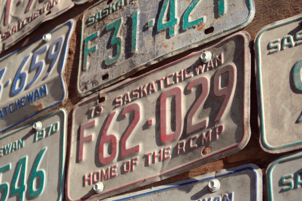 License plates nailed to wall.