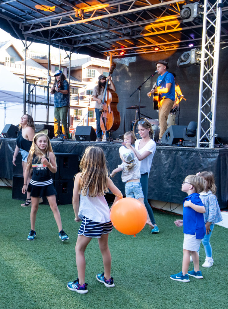 Children and families enjoy the music at a Vail Valley Bluegrass Music Festival in summer.