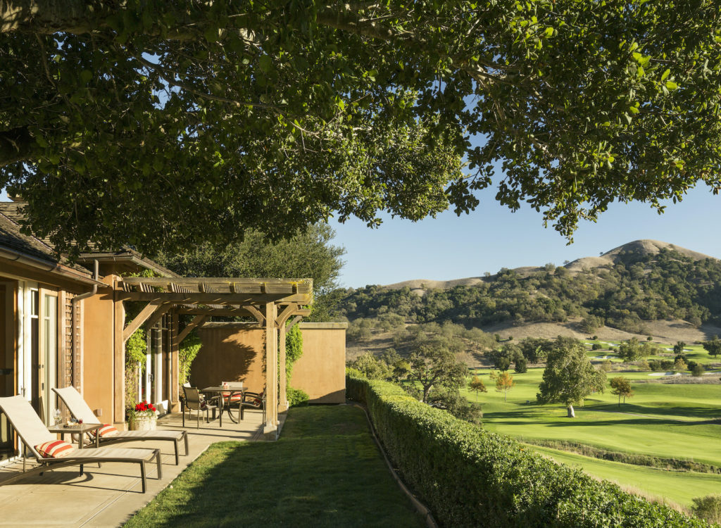 Guest quarters at CordeValle Resort with patio overlooking the hills.