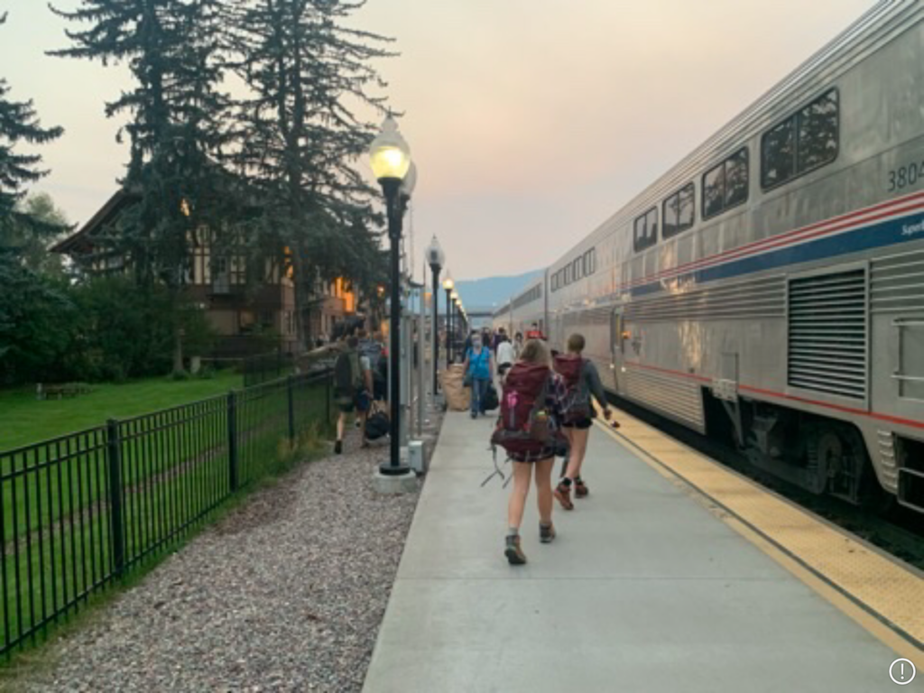 Backpackers disembark at the Amtrak train station at Whitefish, Montana