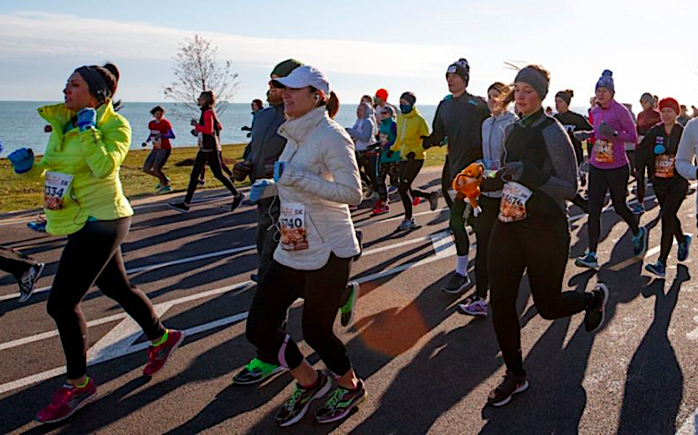 Chicago locals and visitors enjoy running off their Thanksgiving feasts during the weekend races.