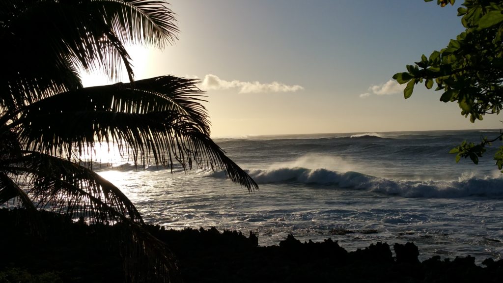 The surf at sundown off the coast of Oahu's North Shore.