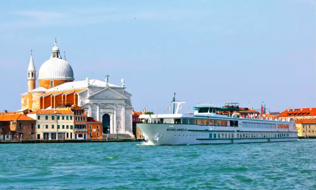 MS Michelangelo river cruiser sails into the port of Venice Italy.