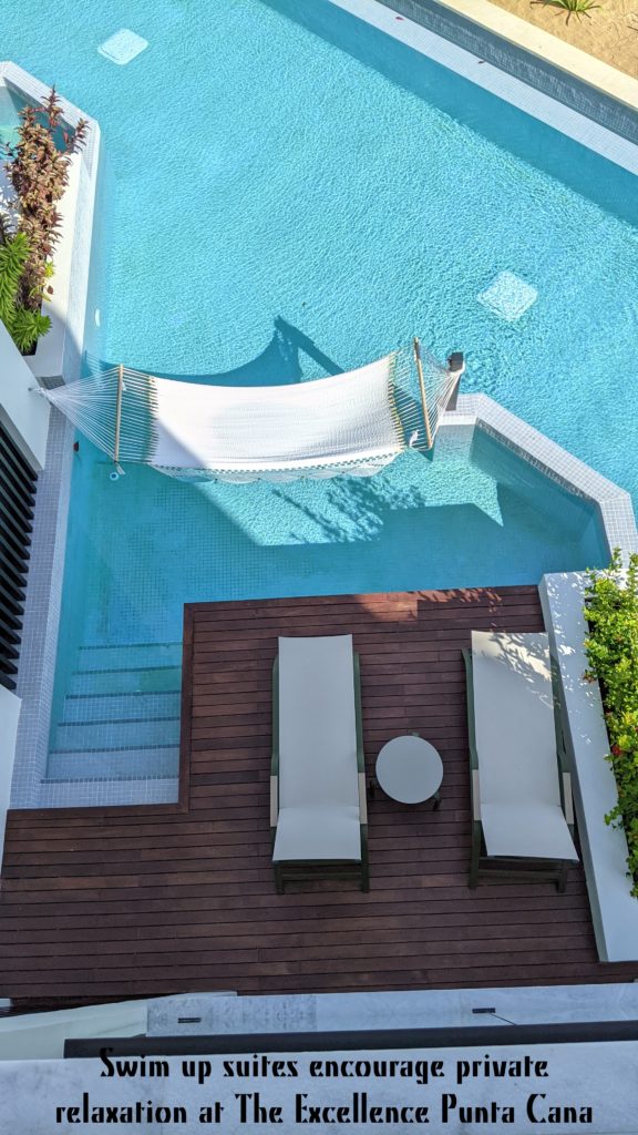 Overhead view of private swimming pool off hotel room deck.