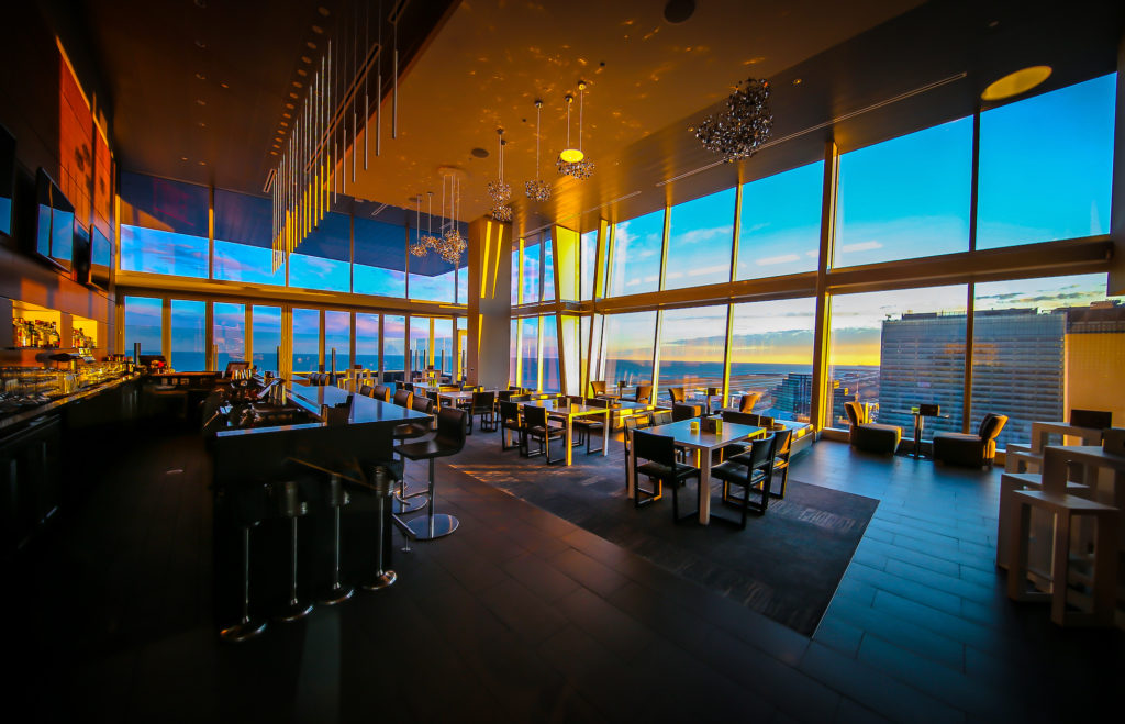 Rooftop bar at the Hilton Cleveland Downtown has maintained social distancing between its tables.