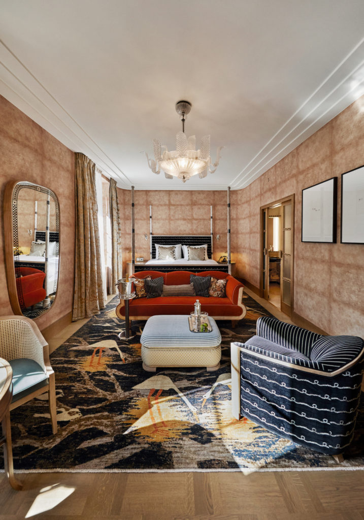 Stylish bedroom with bright colors and carpets at the Sommerro Hotel in Oslo, Norway.