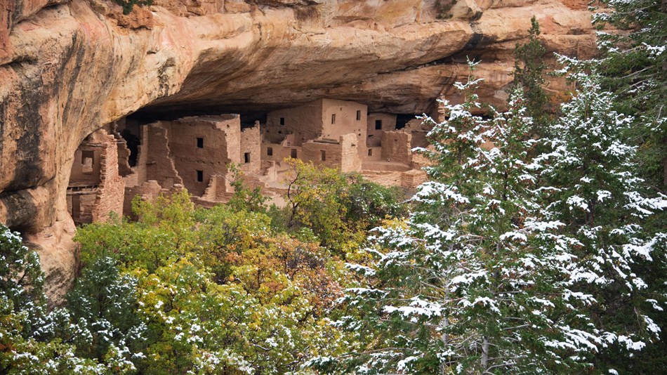 Ancient Pueblo cliff dwellings at Mesa Verde National Park in the snow. Photo c. NPS