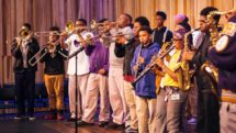 Students from Trombone Shorty Academy practice brass instruments at New Orleans Jazz Museum.