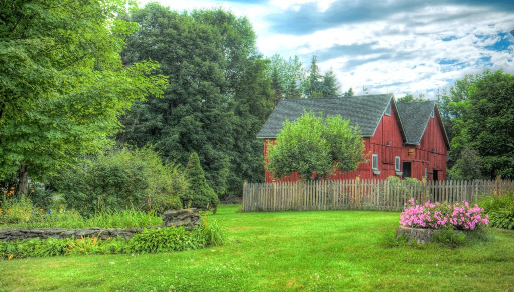 Red barn in beautiful and lush green Vermont countryside