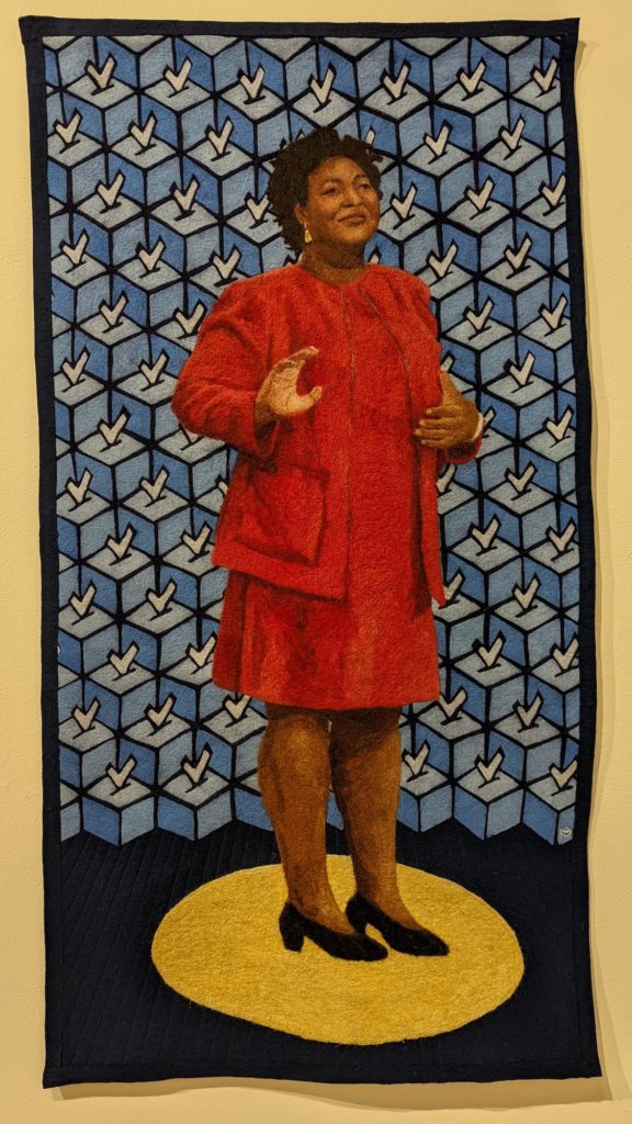 Fabric art portrait of Stacey Abrams during her run for Governor of Georgia by Vanessa Williams at the Cayuga Art Museum.