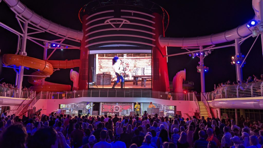 The Scalliwags band plays rock n'roll music during the Disney Wish Pirates Rockin' Parlay Party on Deck 11.