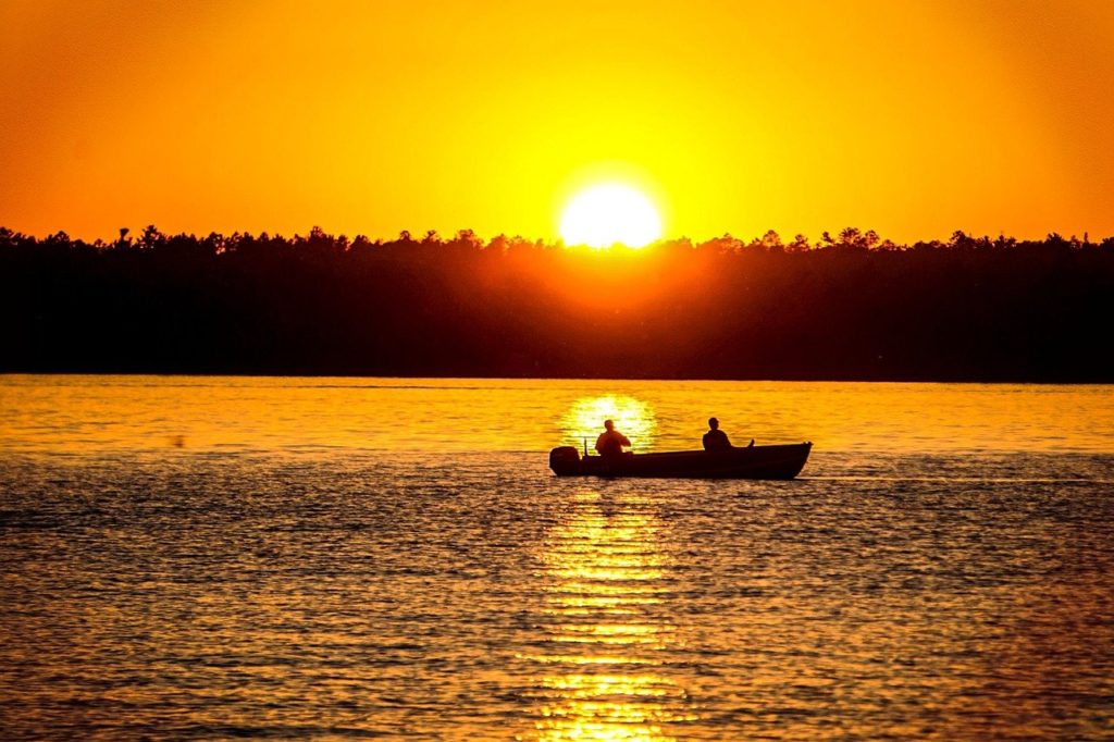 Sunset over Lake Vermilion -- it's beautiful and a great time to go fishing. Photo by Say Gray Images c.pixabay