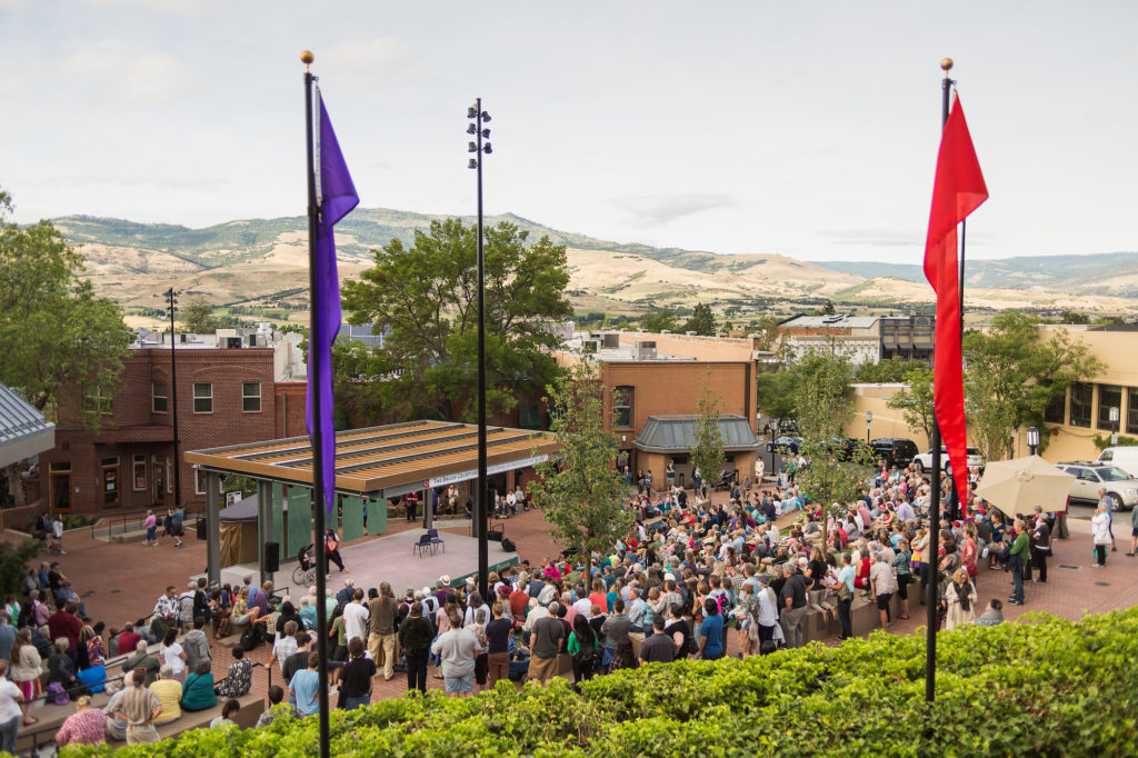 Crowd watching a free Green Show performance on the square outside the Oregon Shakespeare Festival Hall in Ashland, Oregon. Photo c. Travel Southern Oregon
