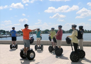Groupd doing a tour on Segways at the Palm Beach marina in Florida.