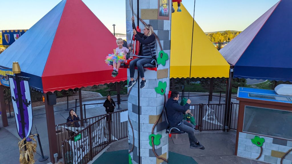 Adults get a workout pulling themselves and their kids up the Tower Ride at the LEGO Castle at LEGOLAND New York.