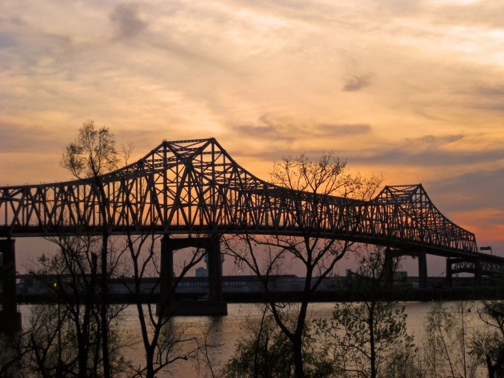 Spooky looking bridge at sunset leads to Baton Rouge.