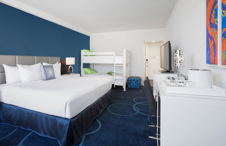 King bed room with bunk beds for kids at the B Hotel at Disney Springs, Orlando, Florida.