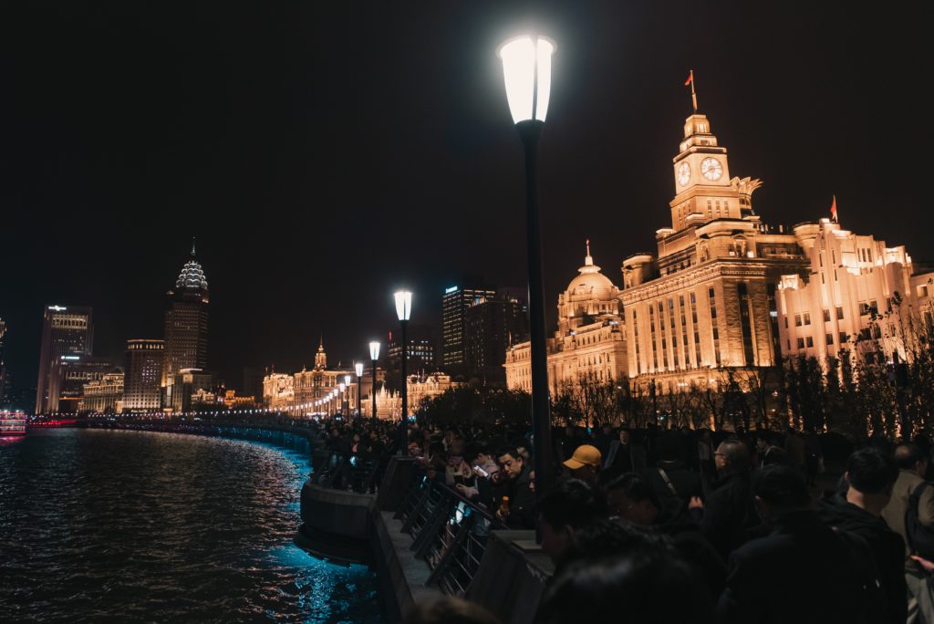 The Old City or Huangpu section of Shanghai, China with the illuminated stone Customs House.