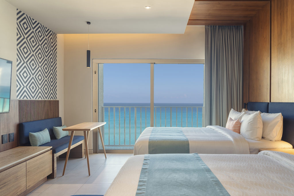 A double bedded family room overlooking the ocean at Royal Uno all inclusive resort.