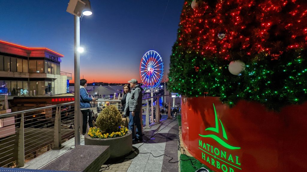 From the National Harbor mezzanine, you can view the Capital Ferris Wheel and holiday tree made of lights.